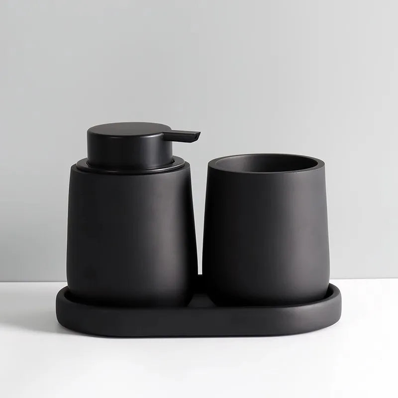 Modern minimalist matte black soap dispenser and tumbler set