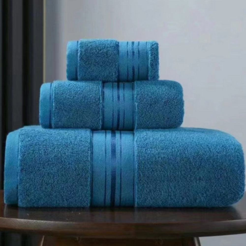 Blue 3-piece spa towel set with woven band and parallel stripe design