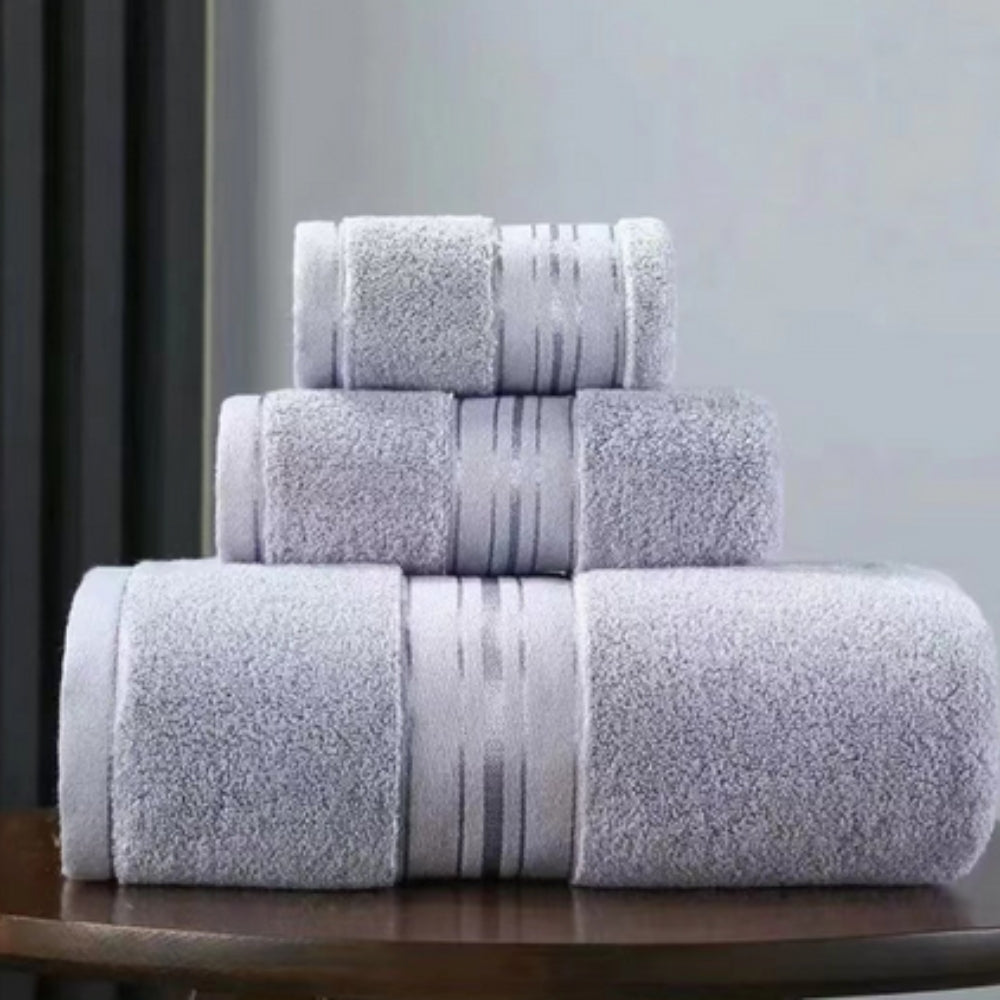 Light gray 3-piece plush bath towel set with terry loops and striped band