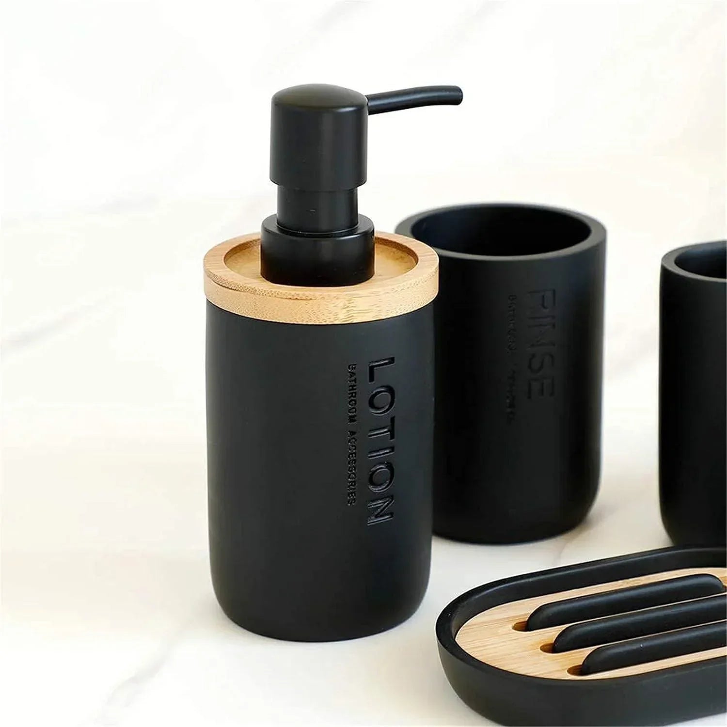 Matte black 4-piece bathroom set with bamboo accents and embossed text