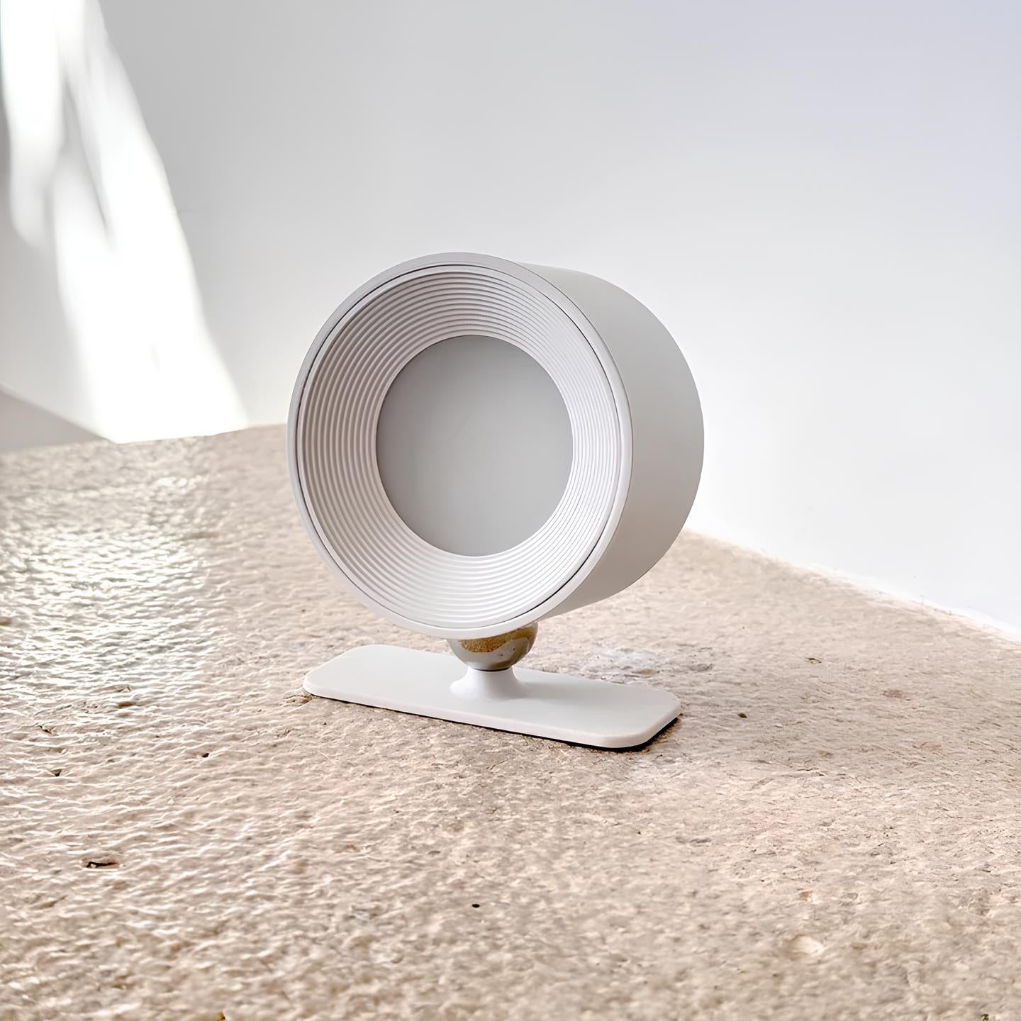 Articulated white wall lamp with spherical joint and gold accent detail