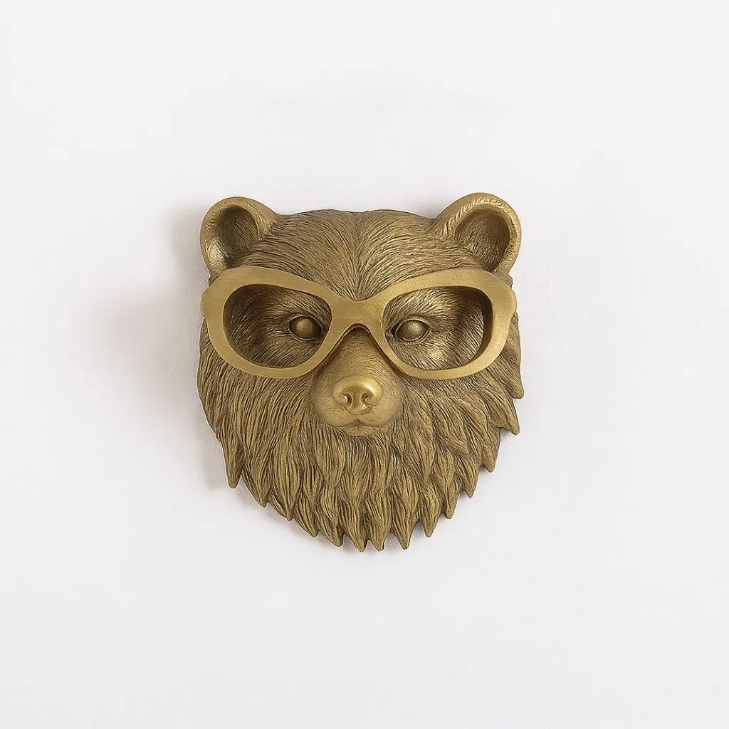 Antique gold bear head wall sculpture with oversized oval glasses