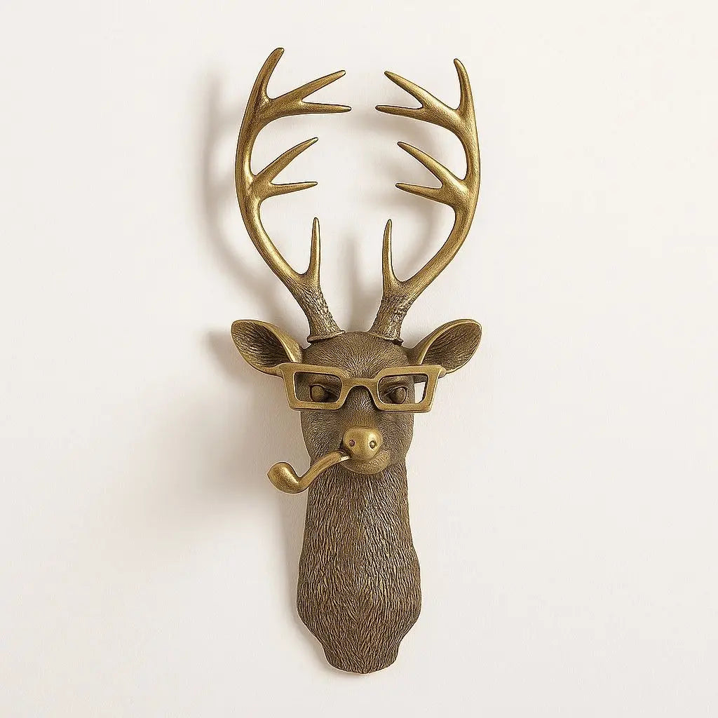 Antique gold deer head wall art with antlers, pipe, and rectangular glasses