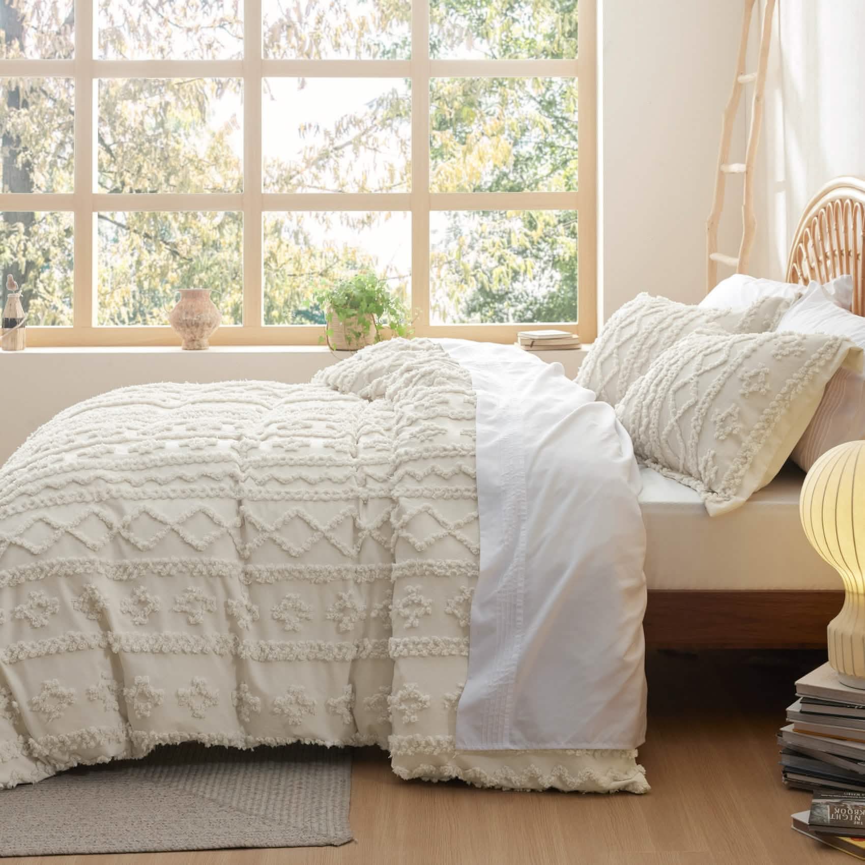 Cream tufted duvet cover set folded back to show white sheet