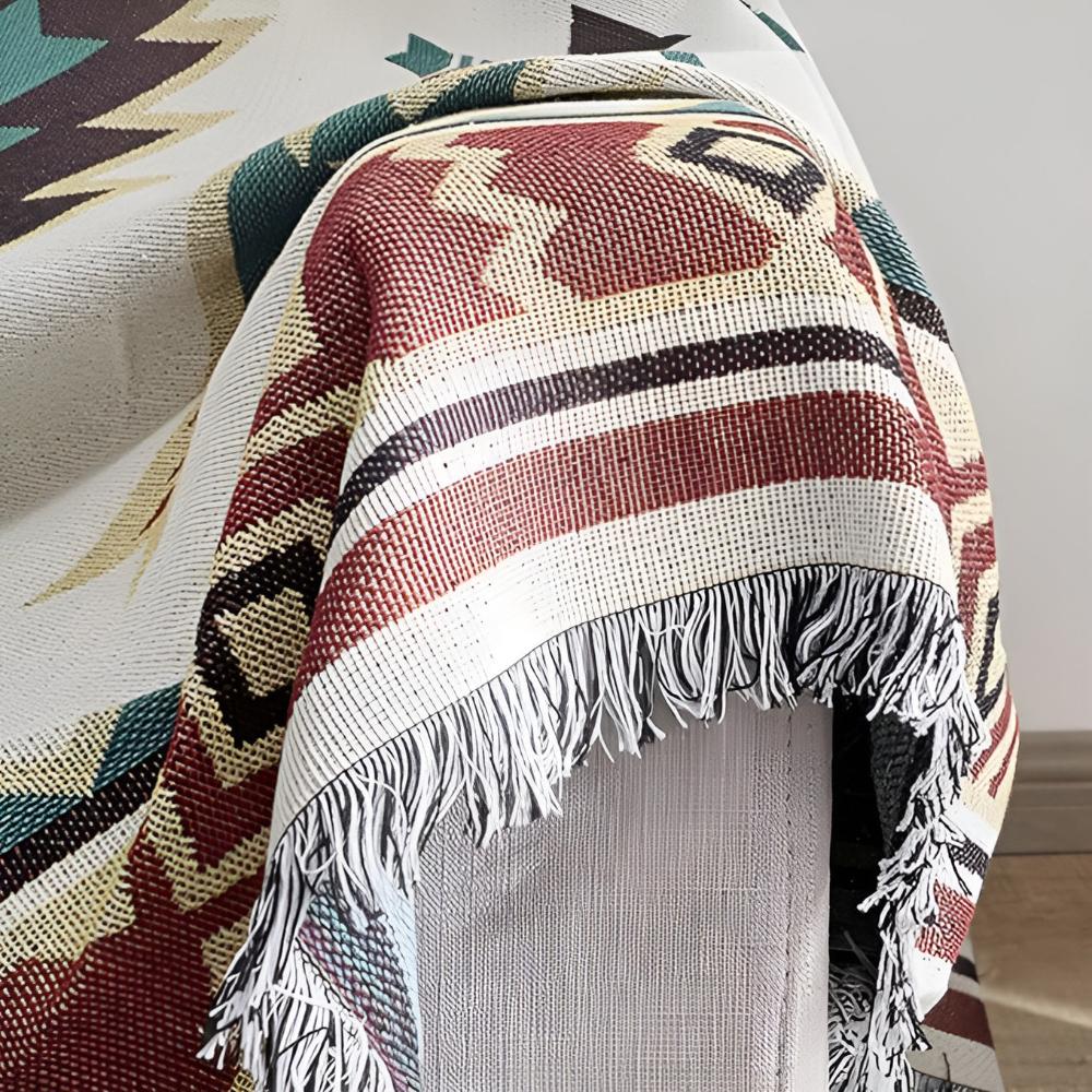 Close-up of terracotta and teal Southwestern throw rug weave texture on chair