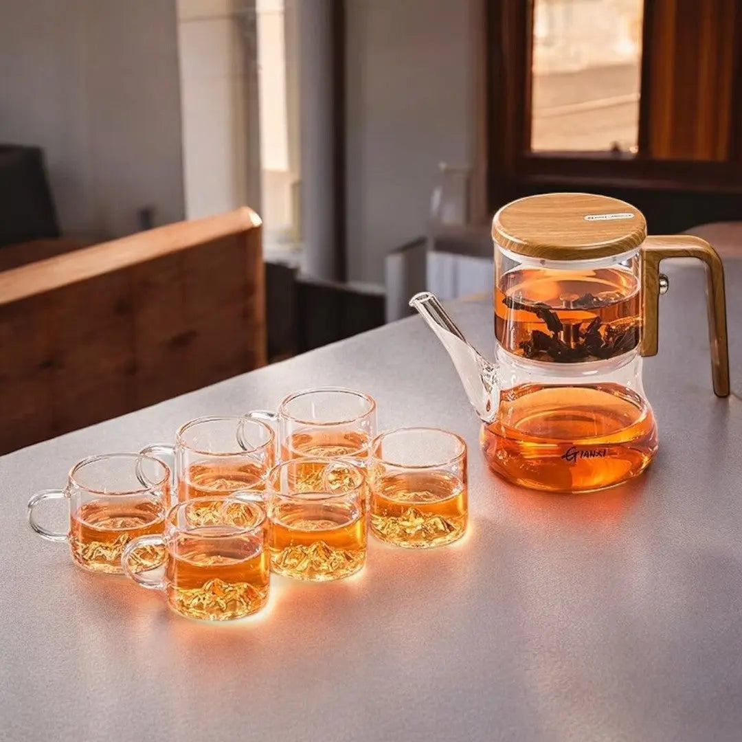 Complete tea brewing set with glass teapot and six mountain-base cups