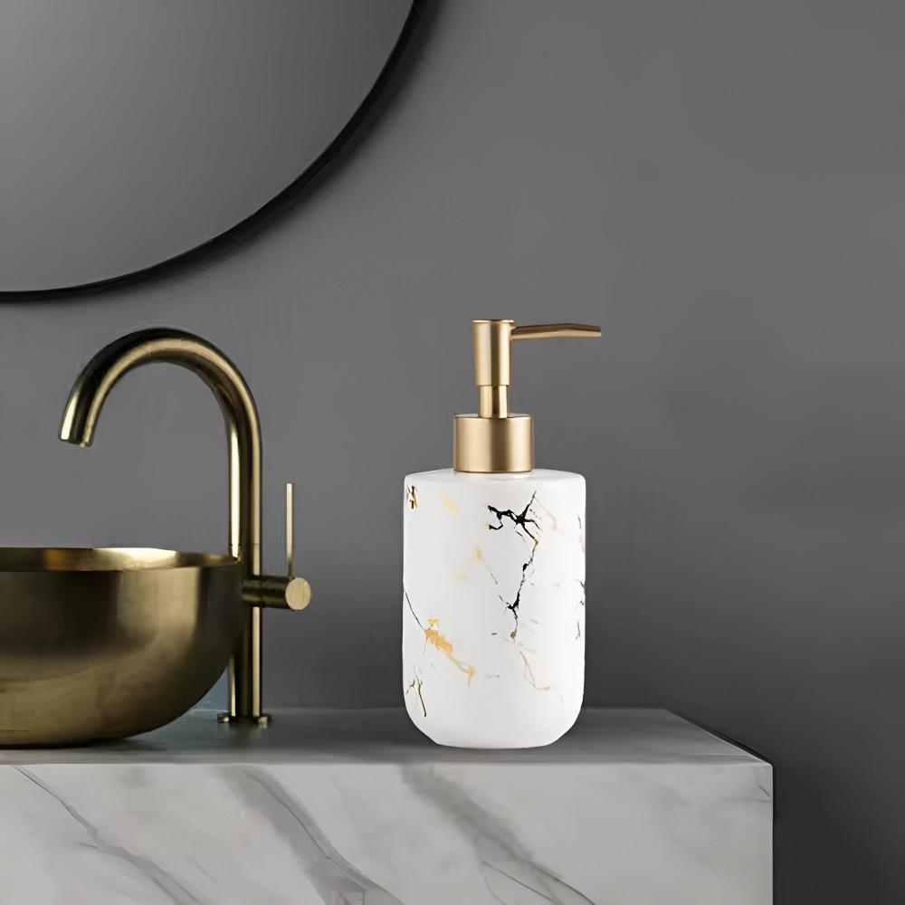 White ceramic soap dispenser with black and gold marble design on bathroom counter