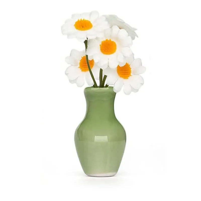 olive green bulbous ceramic magnet vase with white daisies