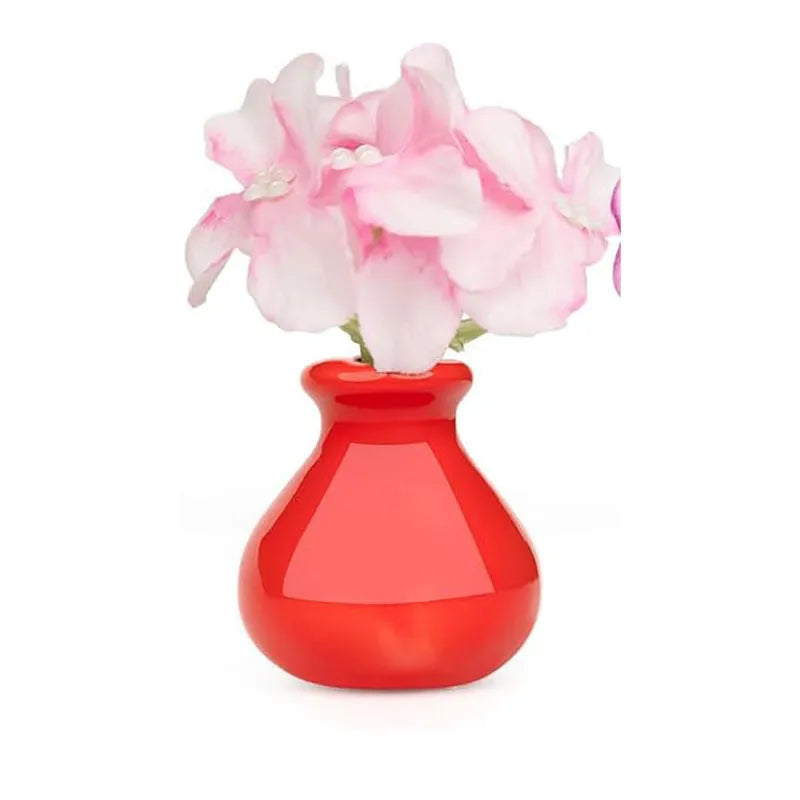 bright red bulbous ceramic magnet vase with pink hydrangea