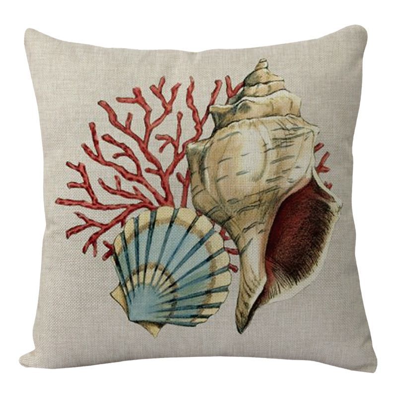 Seashell and coral coastal throw pillow cover on textured fabric