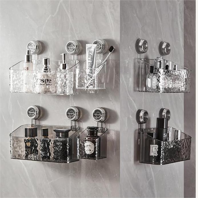 Multiple configurations of clear acrylic shower storage racks on marble