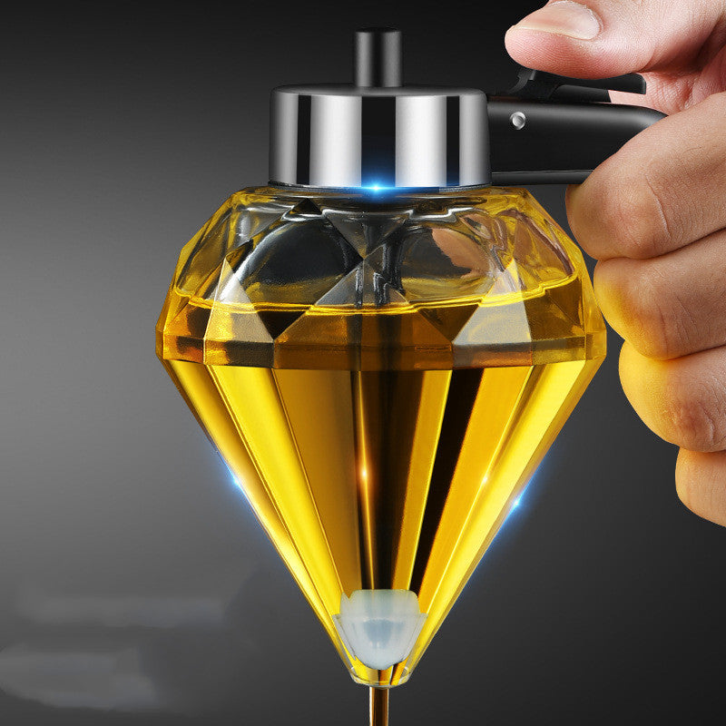Close-up of faceted diamond glass oil dispenser spout