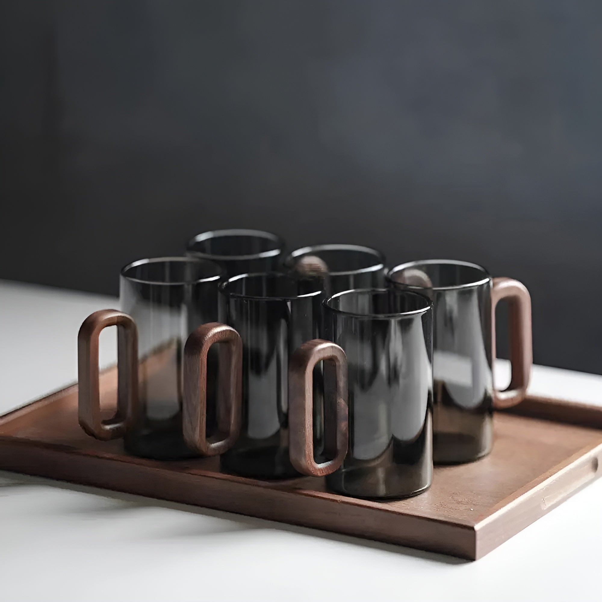 Set of six dark smoked glass highball mugs with natural wooden handles