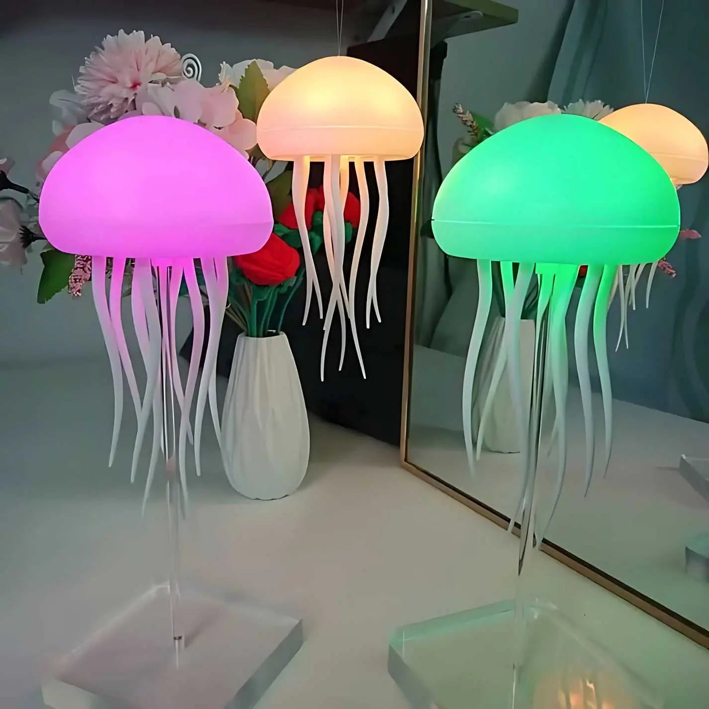 Multi-color jellyfish lamps in pink, white, and green with rechargeable LED lights