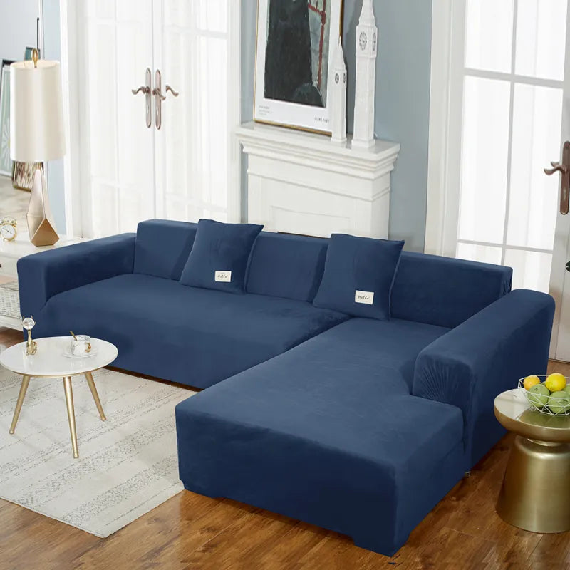 Navy blue stretch velvet sofa cover fitted to sectional with soft drape