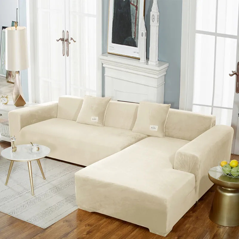 Cream stretch velvet sofa cover on sectional with form-fitting design