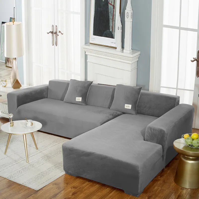 Gray stretch velvet sofa cover on sectional with seamless fit and tags
