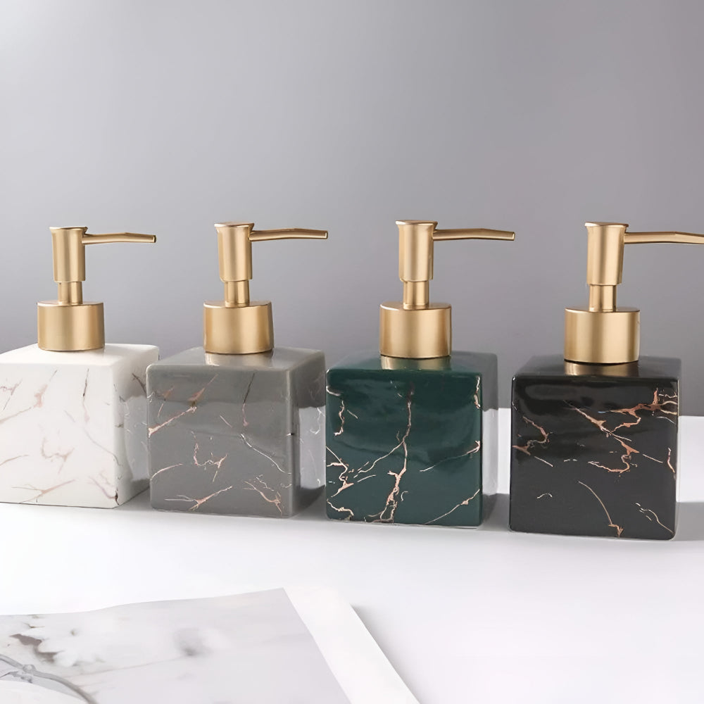 Four color options of marble ceramic soap dispensers with gold pumps