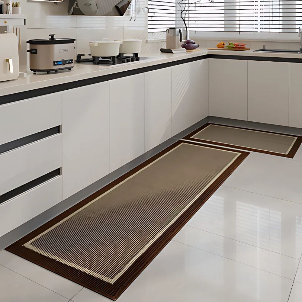 Modern black kitchen runner mat with geometric border and textured stripes on tile
