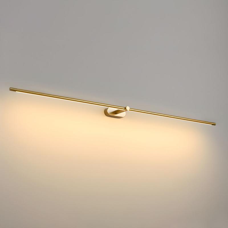 Close-up of matte gold linear wall fixture with central pivot mount detail