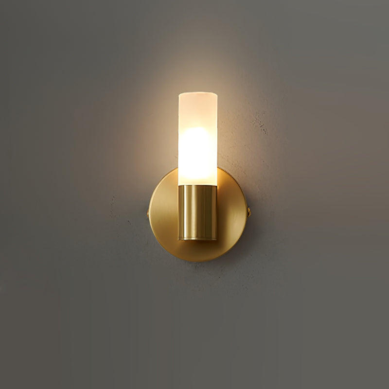 Vertical stack frosted glass wall light emitting warm ambient glow