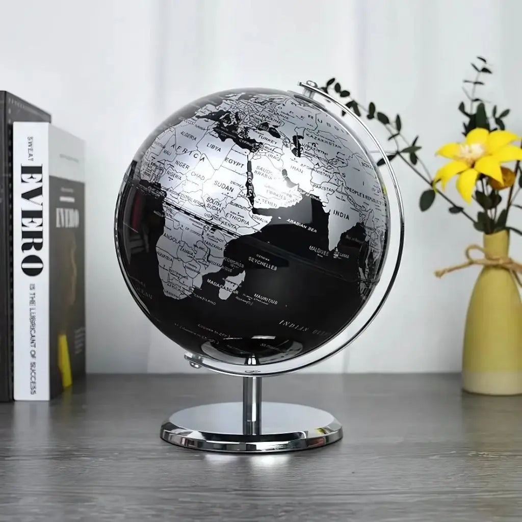 Decorative black globe with silver continents on chrome
