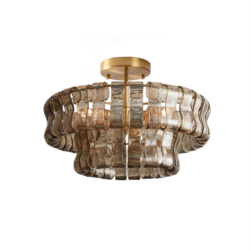 top view of tiered amber textured glass ceiling light on brushed brass frame