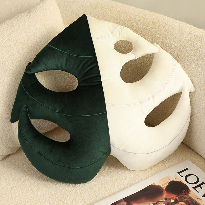 Variegated monstera leaf plush pillow with deep green and off-white split design