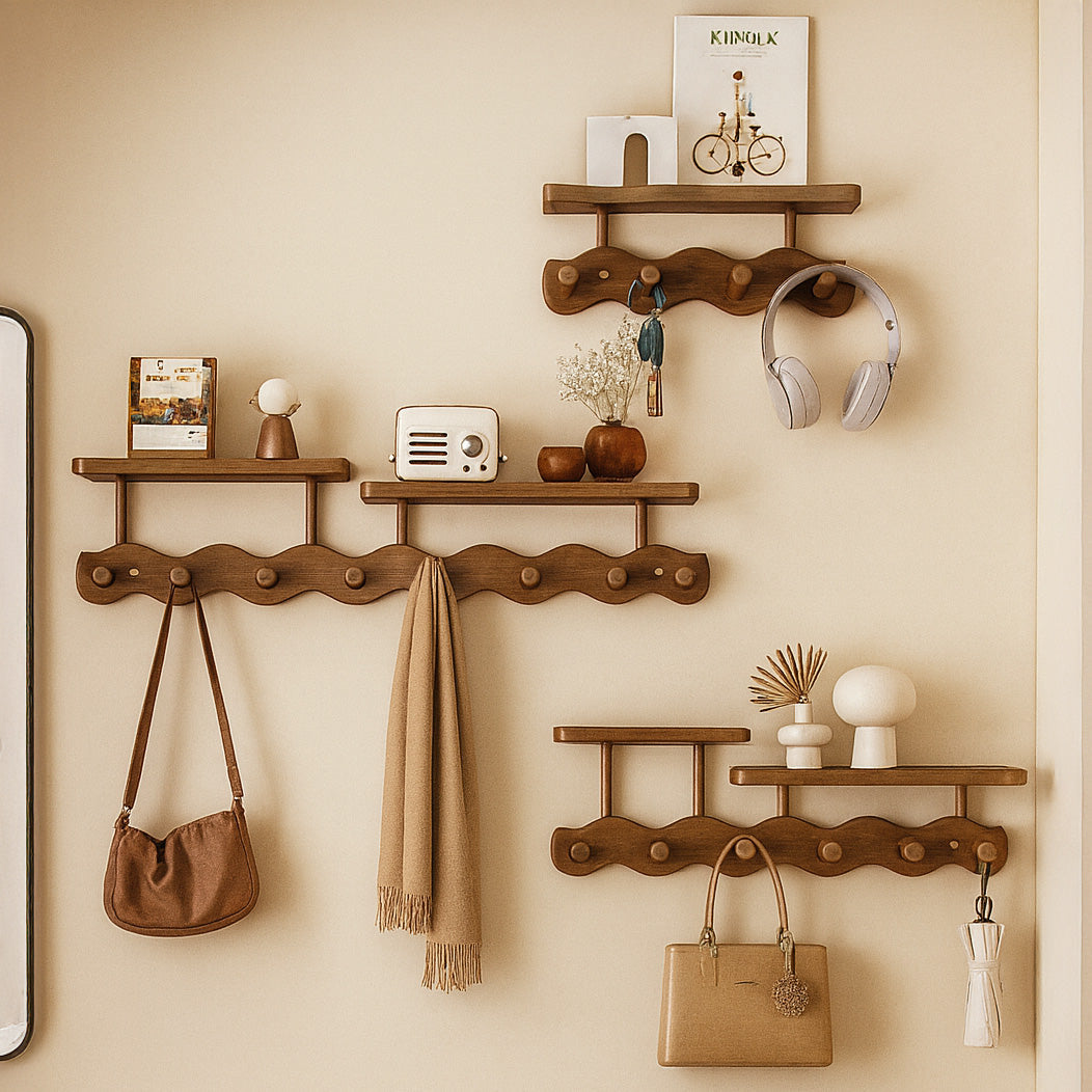 Multi-level bamboo entryway storage rack with floating shelves and curved pegs for coats
