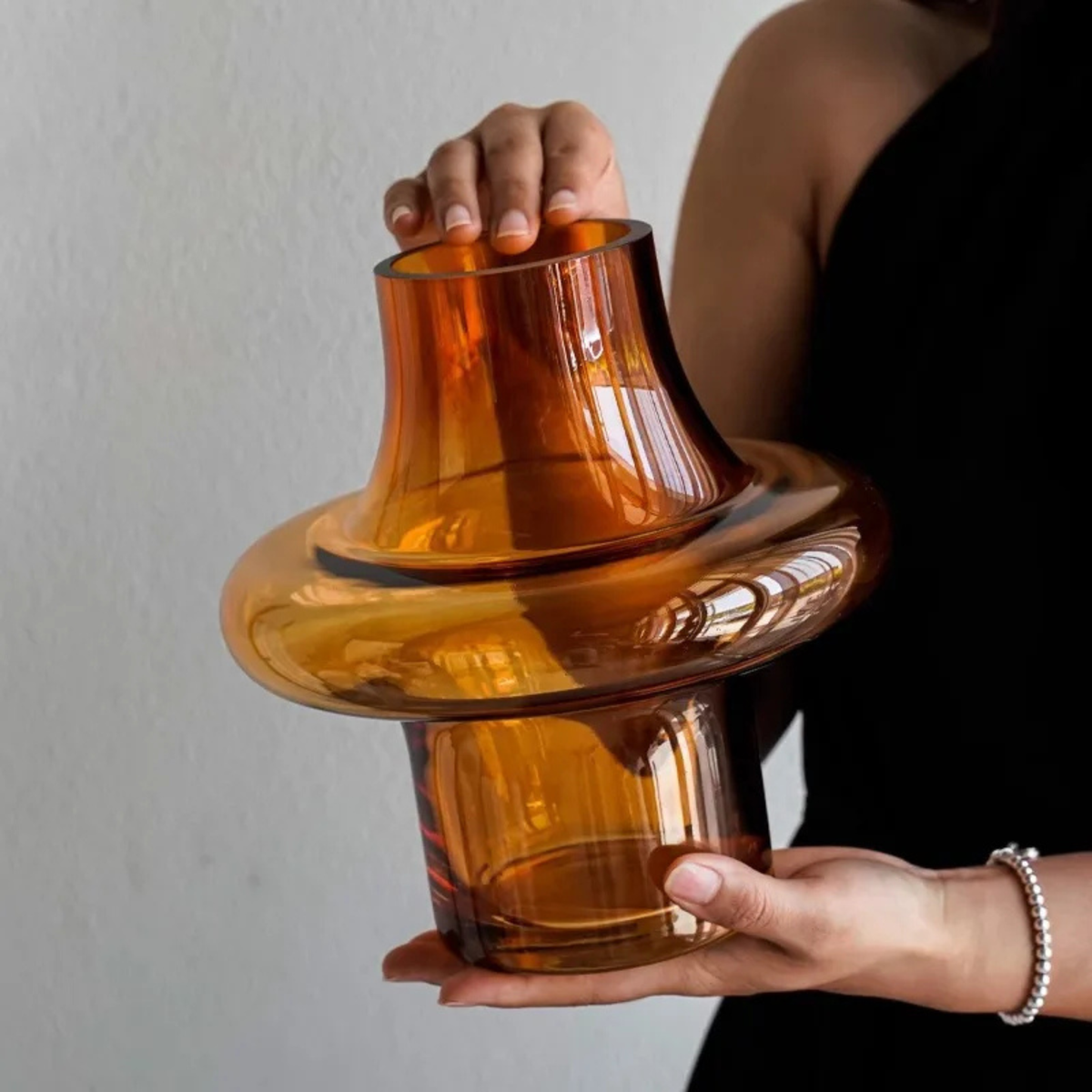 Nordic Flower Vase narrow waist amber tinted glass planter held in hand