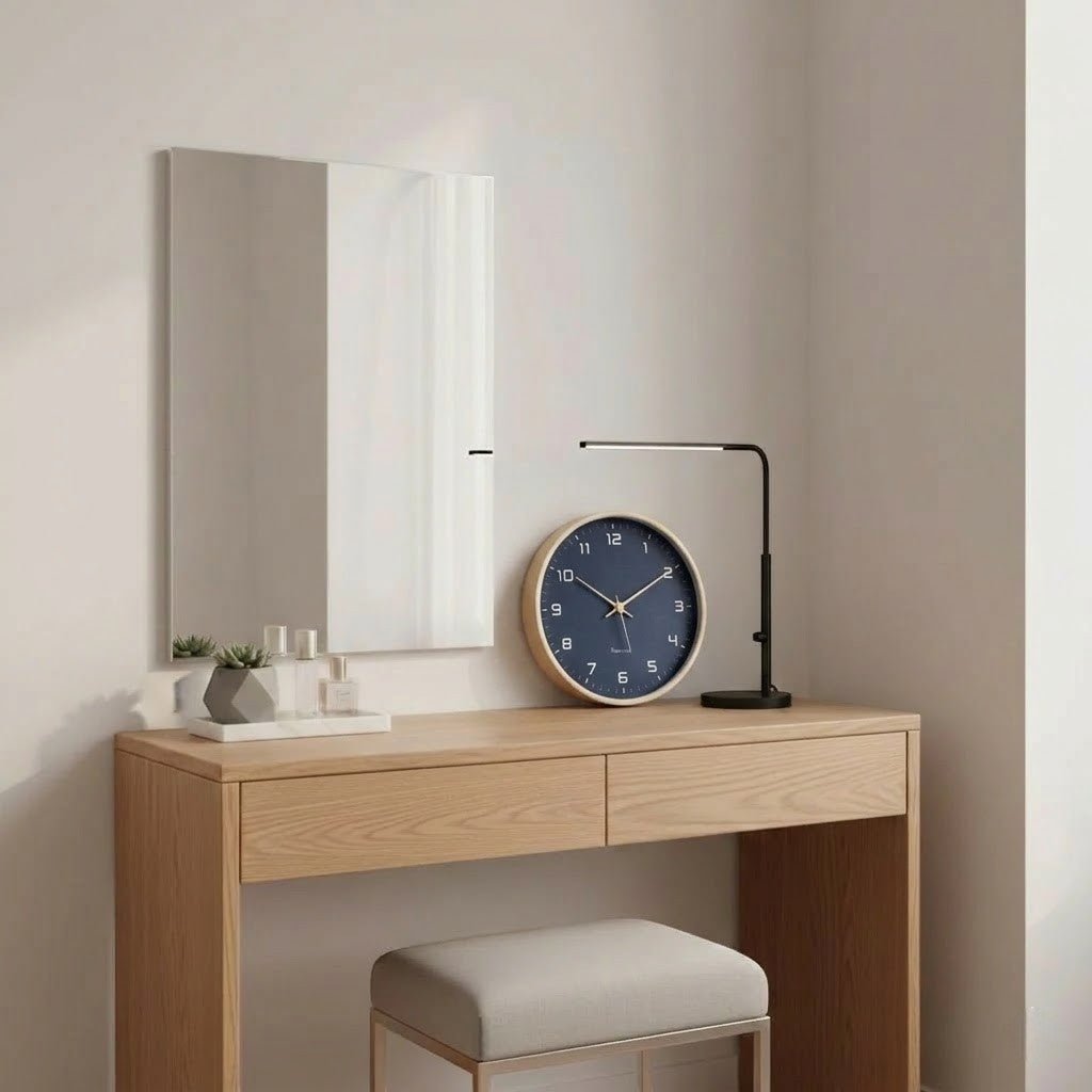 Navy blue Nordic wood wall clock displayed on oak desk with decor
