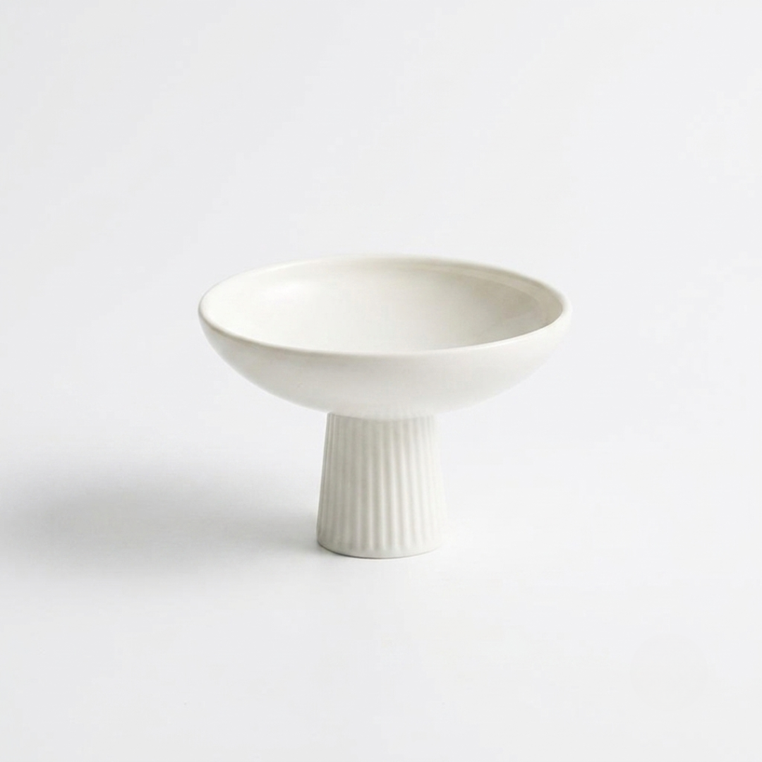 White ceramic pedestal dessert bowl with fluted footed base