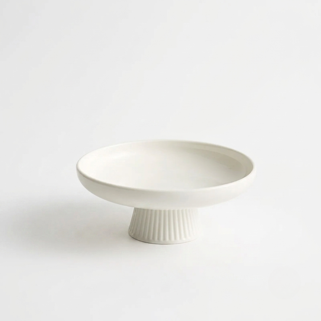 Minimalist white raised serving platter with vertical ridges