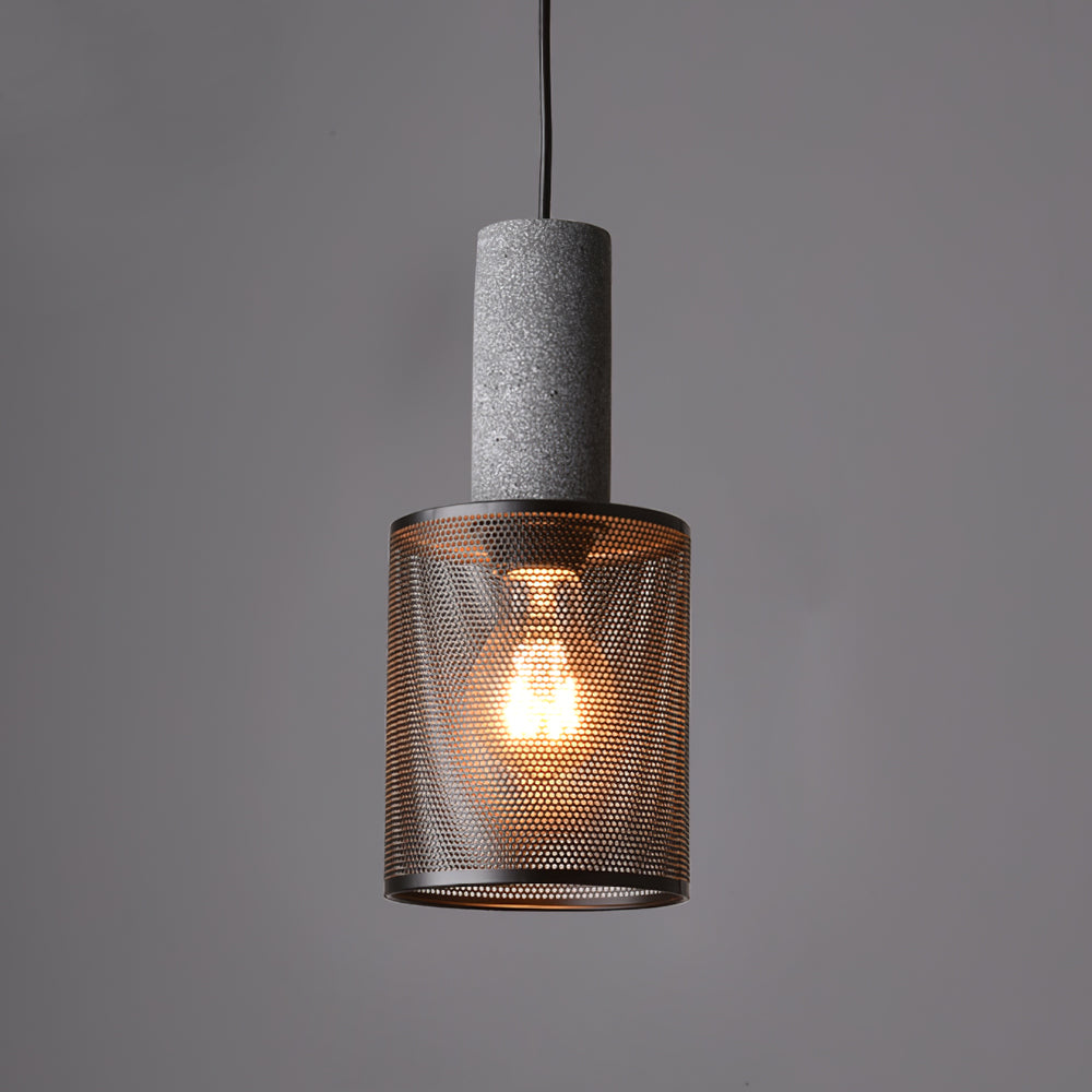 Contemporary pendant with concrete socket and medium perforated drum shade