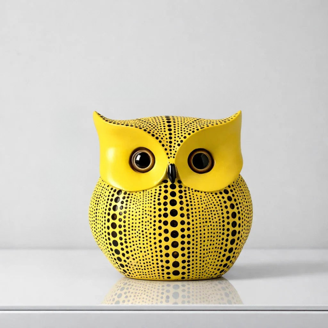 Yellow polka dot owl figurine with large round eyes and ear tuft details