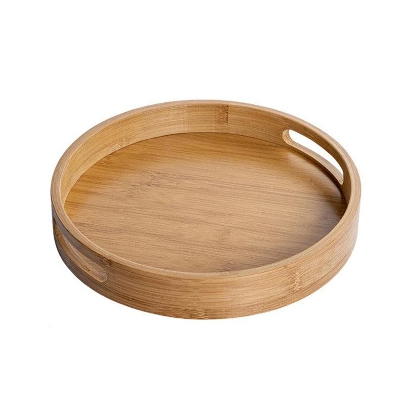 Round bamboo serving tray with integrated cutout handles and smooth polished wood grain