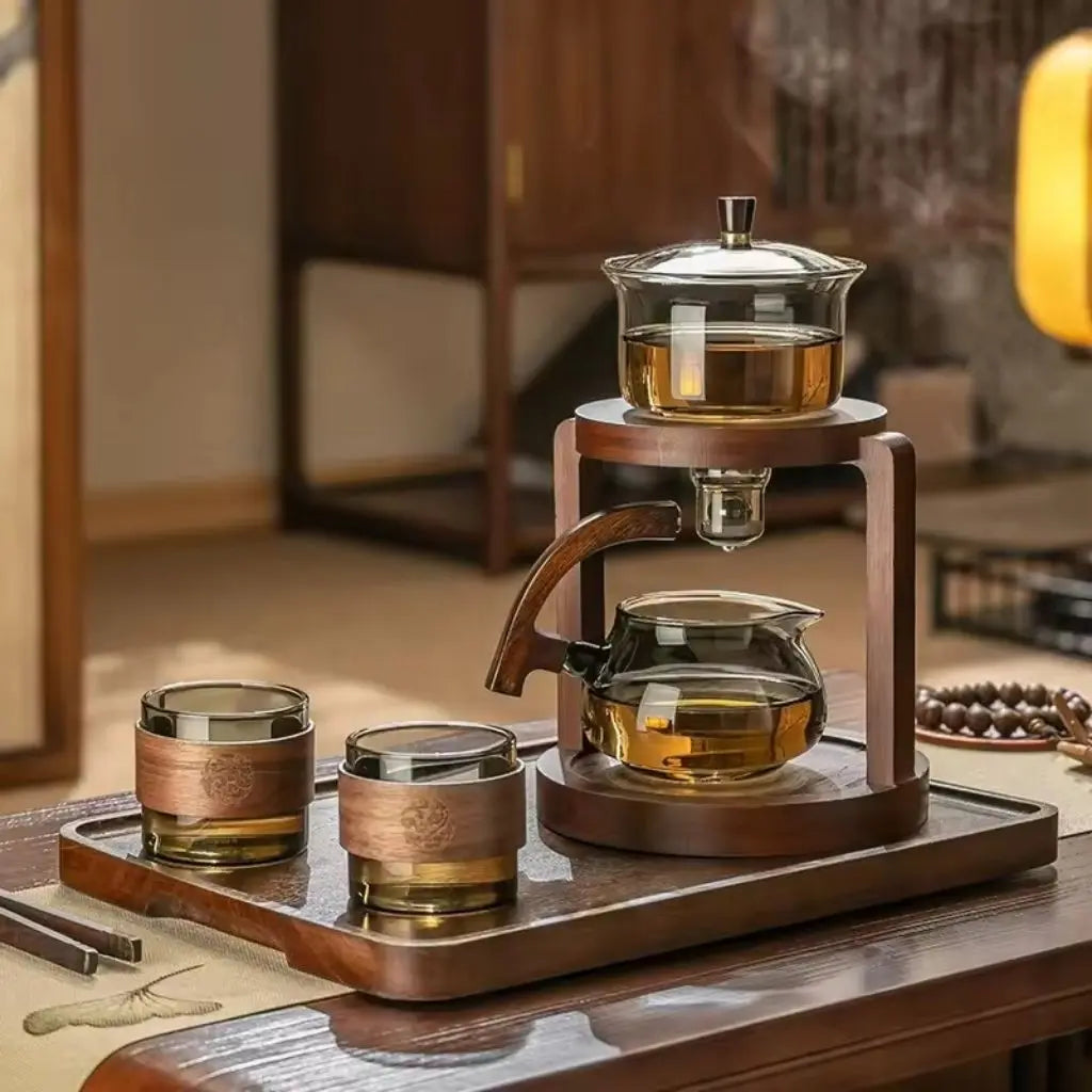 Chinese kung fu tea set with six cups on wooden tray holding amber loose leaf tea