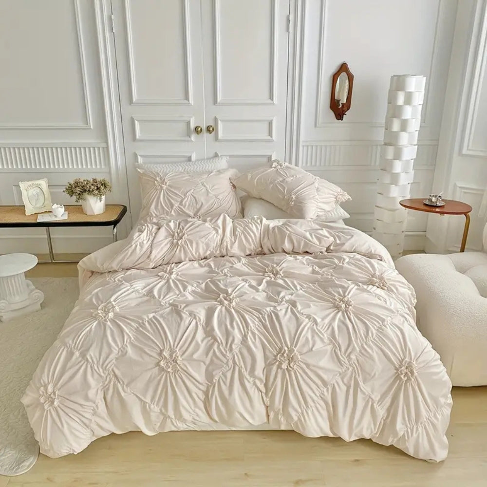 Ivory bedding set showing diamond grid floral rosette pattern on bed