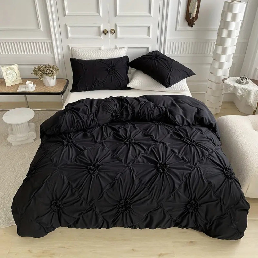 Black version of ruched floral rosette duvet cover set on bed