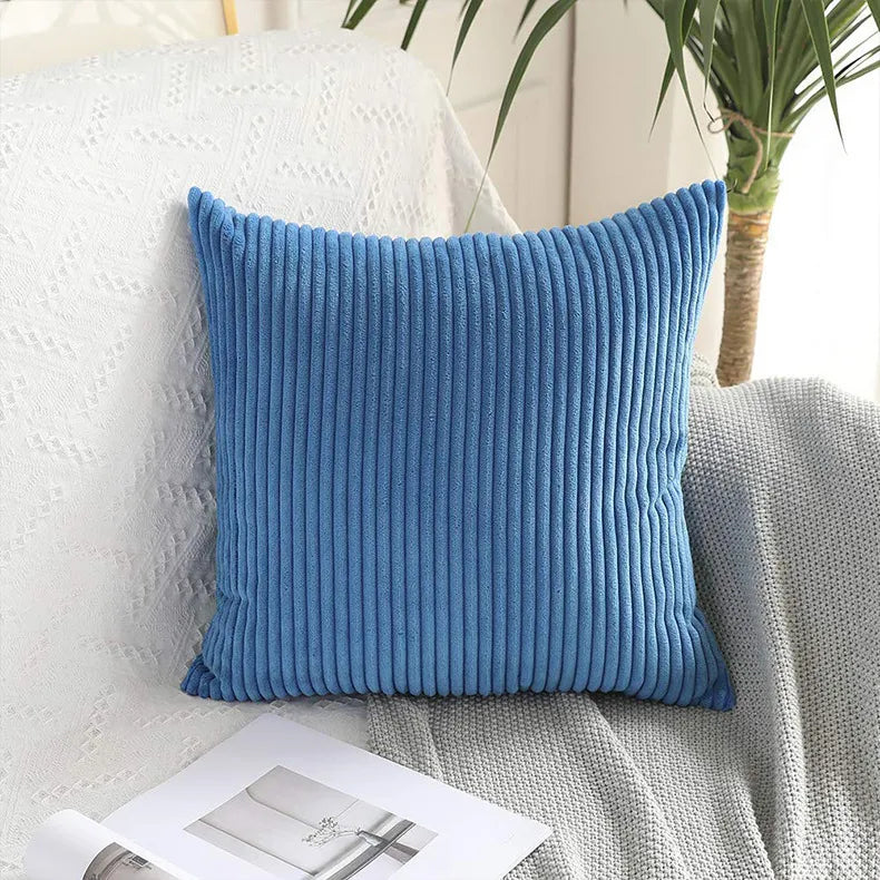 Medium blue ribbed corduroy pillow cover with dimensional corn stick pattern
