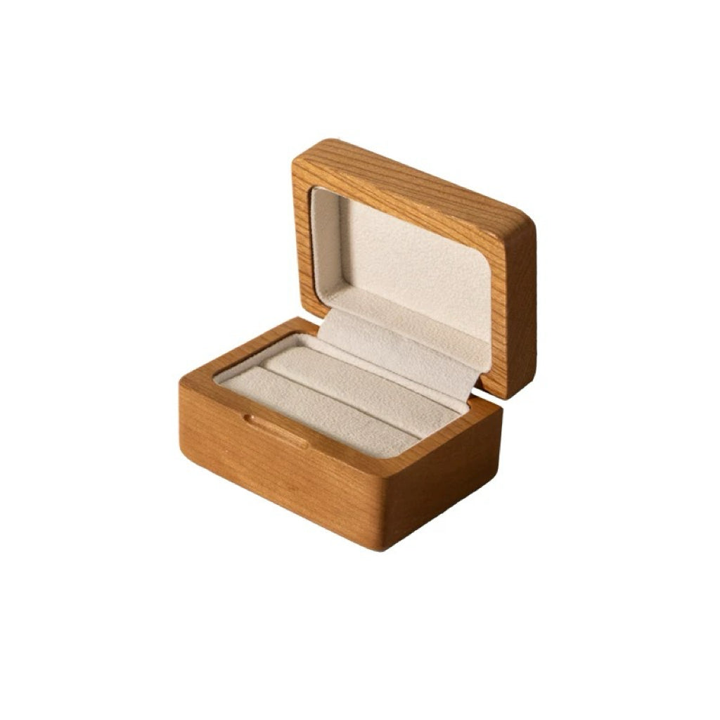 Open cream velvet single ring holder with light walnut wood grain and molded slot