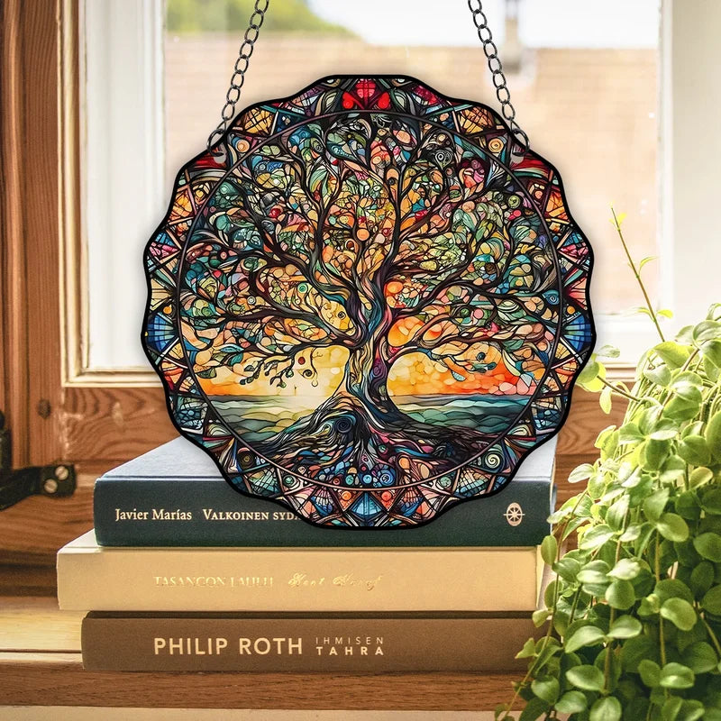 Multicolor acrylic Tree of Life wall art displayed above books with plant
