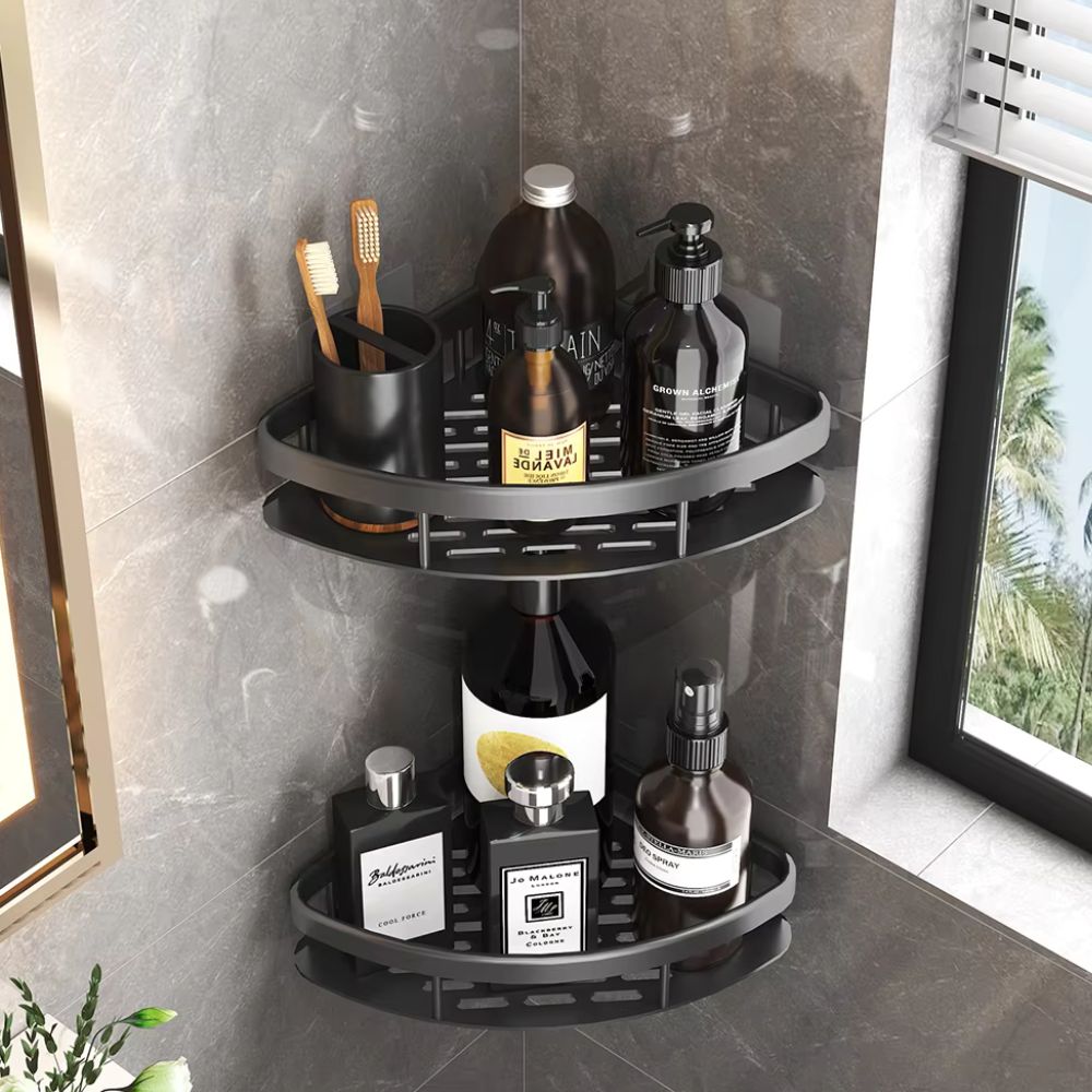 Black matte corner shower rack with curved rim installed near window holding perfumes