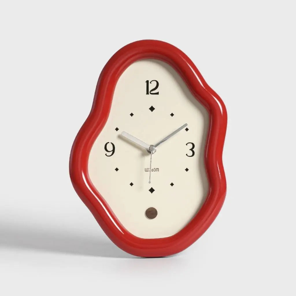 Vibrant red wavy frame table clock with cream face and silver hands