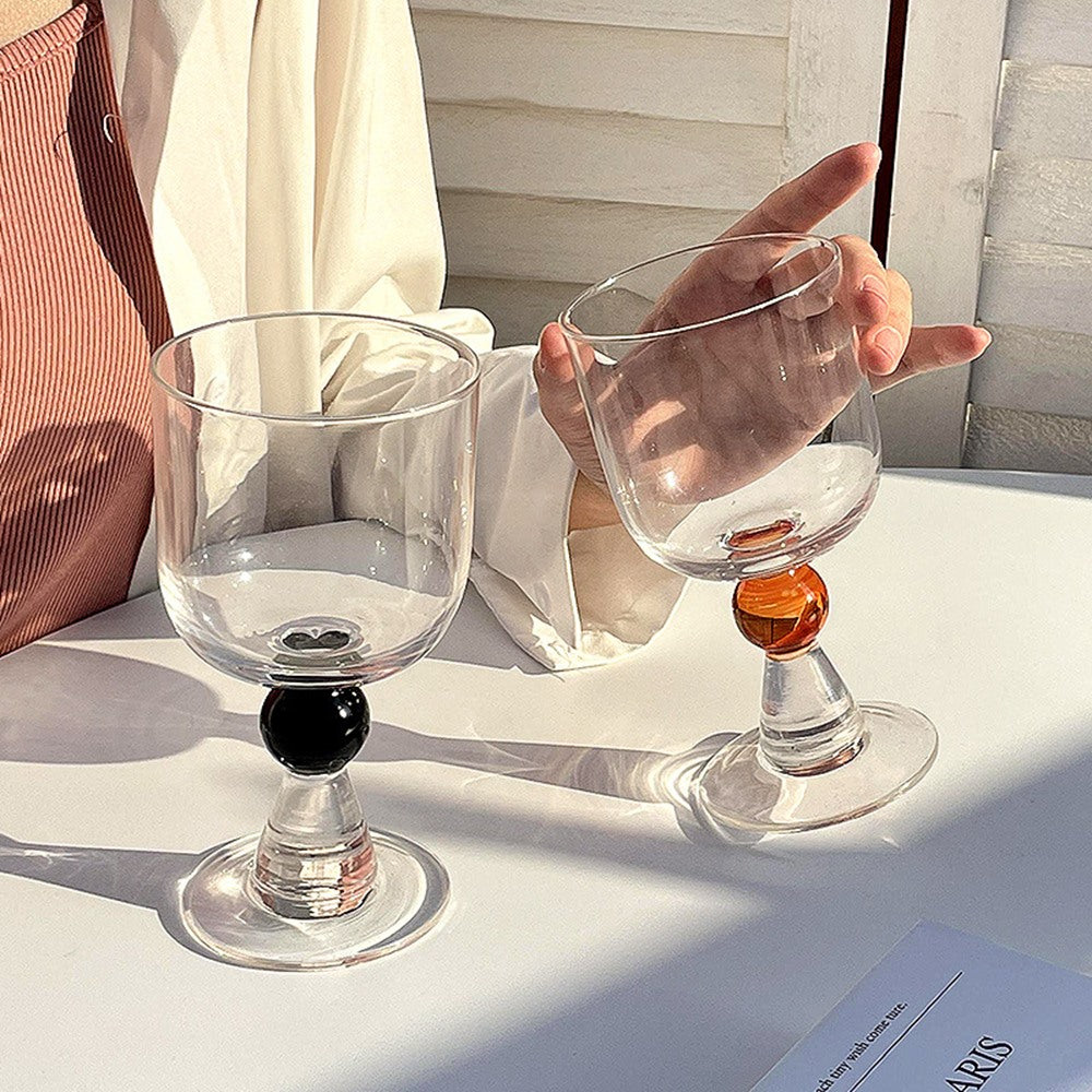 Maintained House Ball Stem Wine Glass Set - Black and Amber in hand
