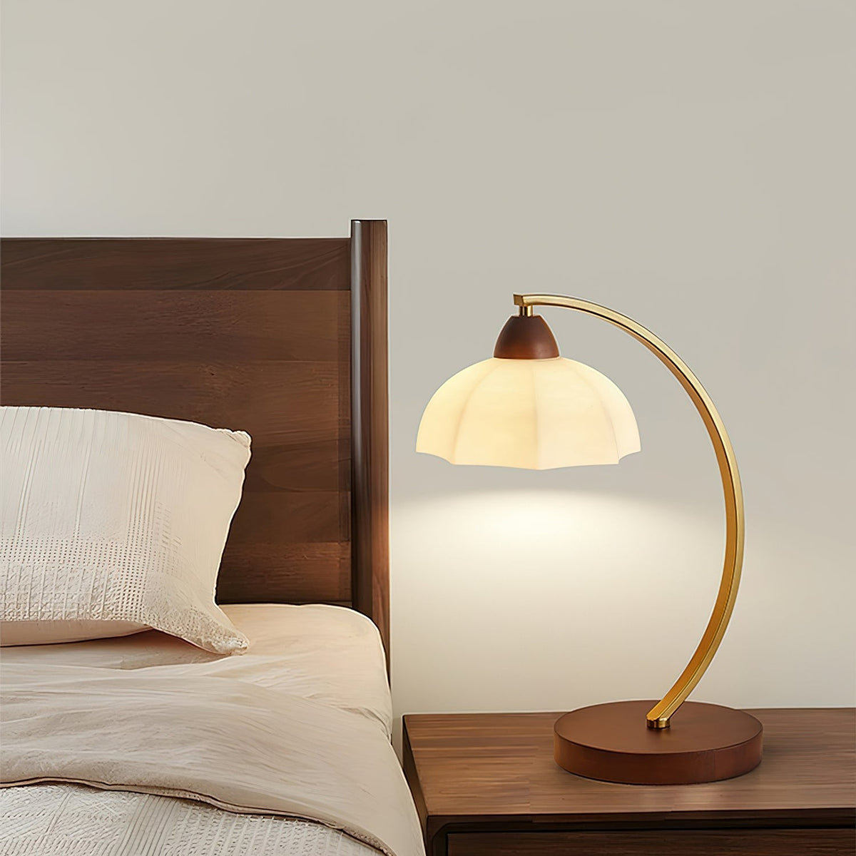 Maintained House Curved Brass Arm Table Lamp - Beside a bed