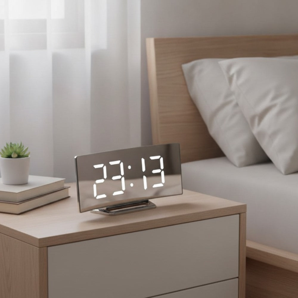 Maintained House Curved Mirror LED Alarm Clock - White display on a nightstand