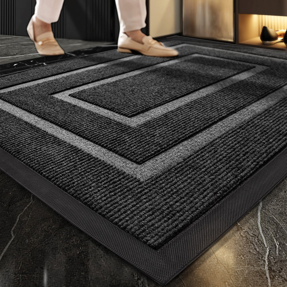 Maintained House Double Border Ribbed Doormat - Black in an entryway