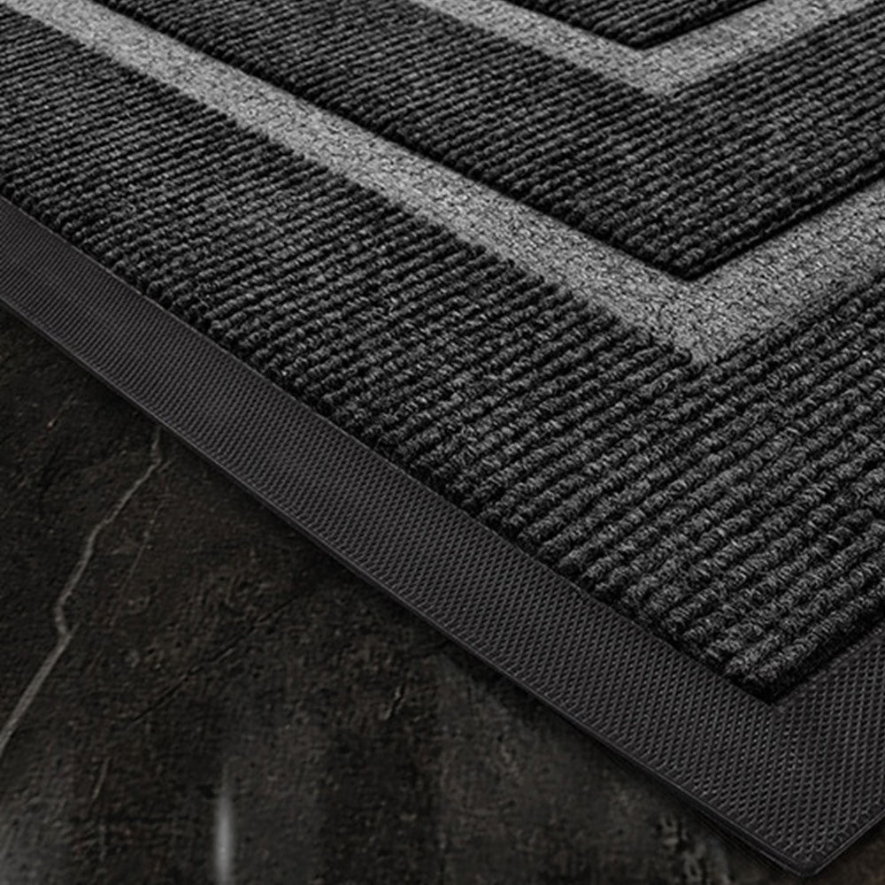 Maintained House Double Border Ribbed Doormat - Close-up of the black ribbed pile and rubber edge
