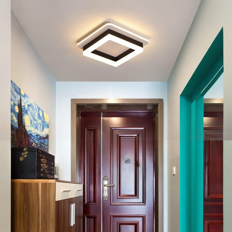 Maintained House Floating Ring LED Ceiling Light - Square in Black above an apartment entry door